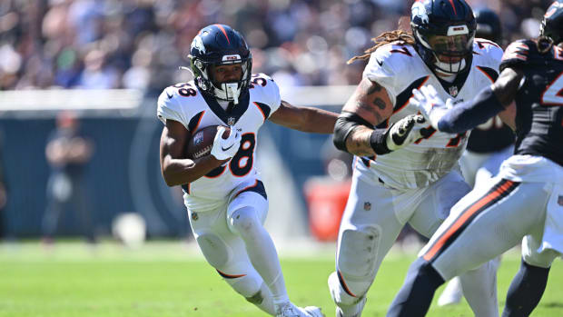 Denver Broncos running back Jaleel McLaughlin (38) takes off on an 18-yard touchdown run in the first quarter against the Chicago Bears at Soldier Field.